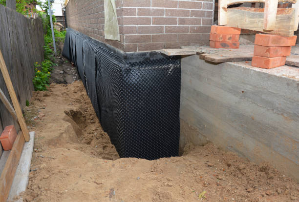 Happy homeowners after waterproofing job in Curtice